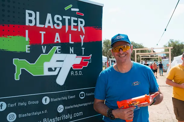 Evento Blaster Italy con partecipante sorridente.